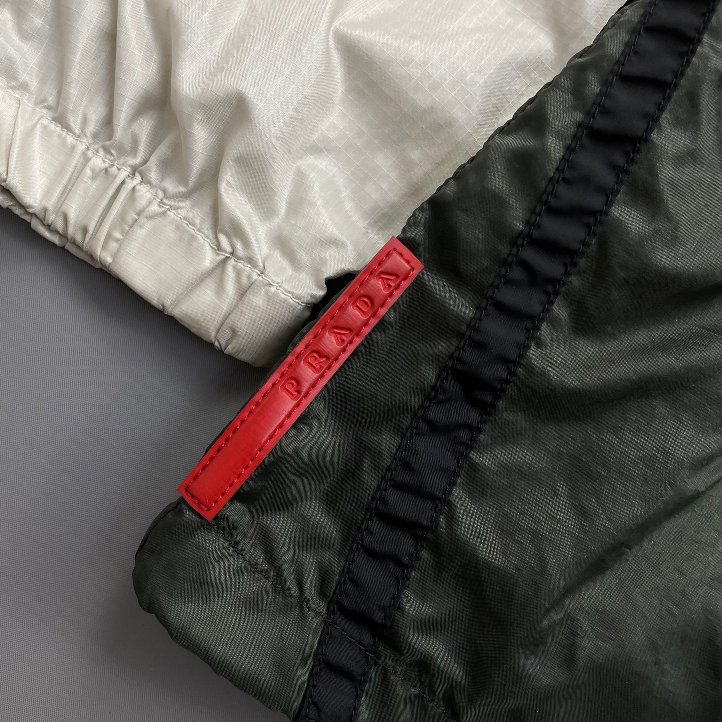 Prada Sport White Black & Green 2008 Lightweight Concealed Hood Nylon Windbreaker Jacket