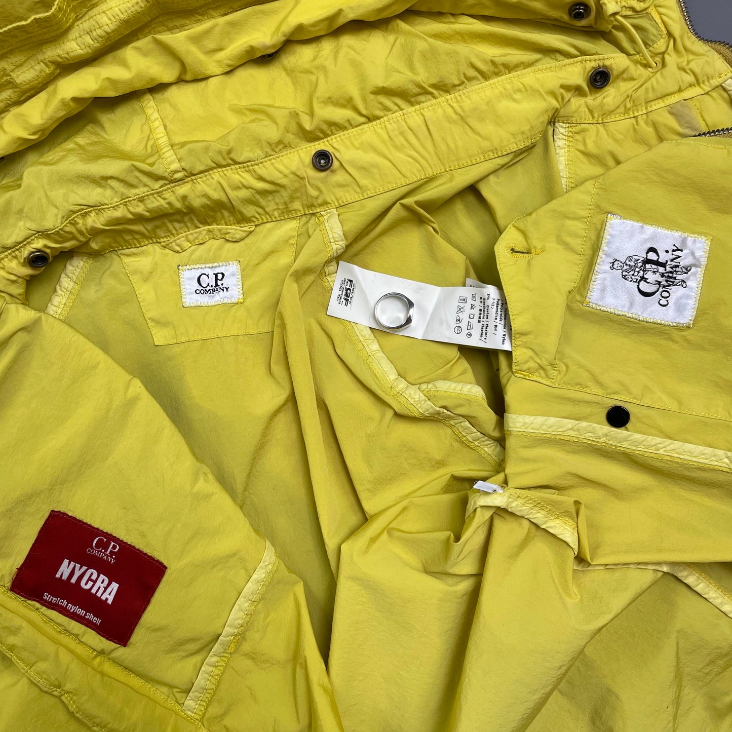 C.P. Company Yellow Nycra Nylon Chest Lens Hooded Windbreaker Jacket